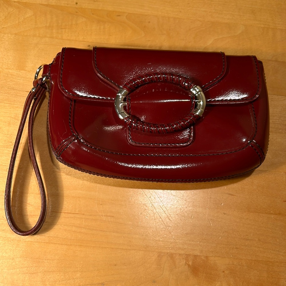 Ann Taylor, small burgundy wristlet with silver on buckle.